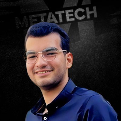 Smiling man with glasses, Metatech background.